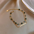 Pulsera doble con charms