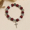 Pulsera de cuentas rojas y colgante de San Benito de estilo vintage: símbolo apreciado de guía divina