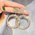 Pendientes de circonita en oro y plata