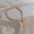 Pulsera de perlas rosas en oro