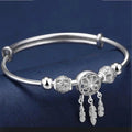 Pulsera ajustable con colgantes de tres hojas en plata