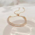 Pulsera ajustable de circonita cúbica en oro y plata