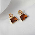 Elegantes pendientes de cristal del desierto en oro