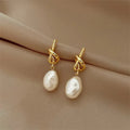 Elegantes pendientes con perlas barrocas en oro