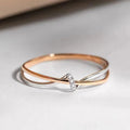 Anillo entrelazado en oro rosa y plata