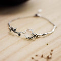 Pulsera vintage de plata con ramo de flores
