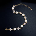 Pulsera vintage con perlas y hojas en oro