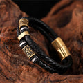 Pulsera de cuero trenzado negro con colgante dorado