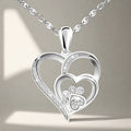 Collar en plata de ley con pata y corazón con circonita